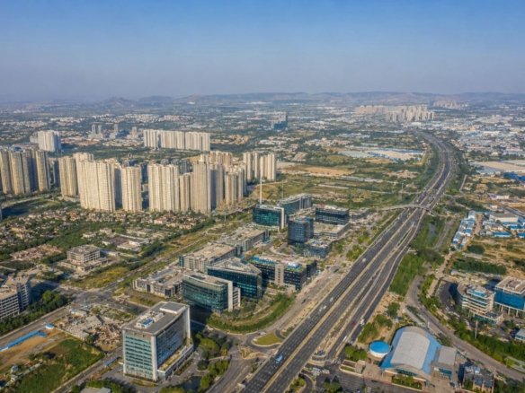 Aerial view of the Gurgaon Manesar Sohna Corridor showing highways, residential developments and commercial growth zones